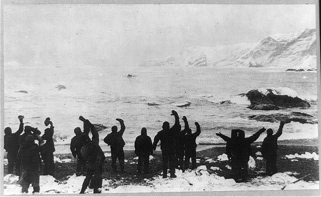 Elephant Island party waving toward a boat — actual institutional image
